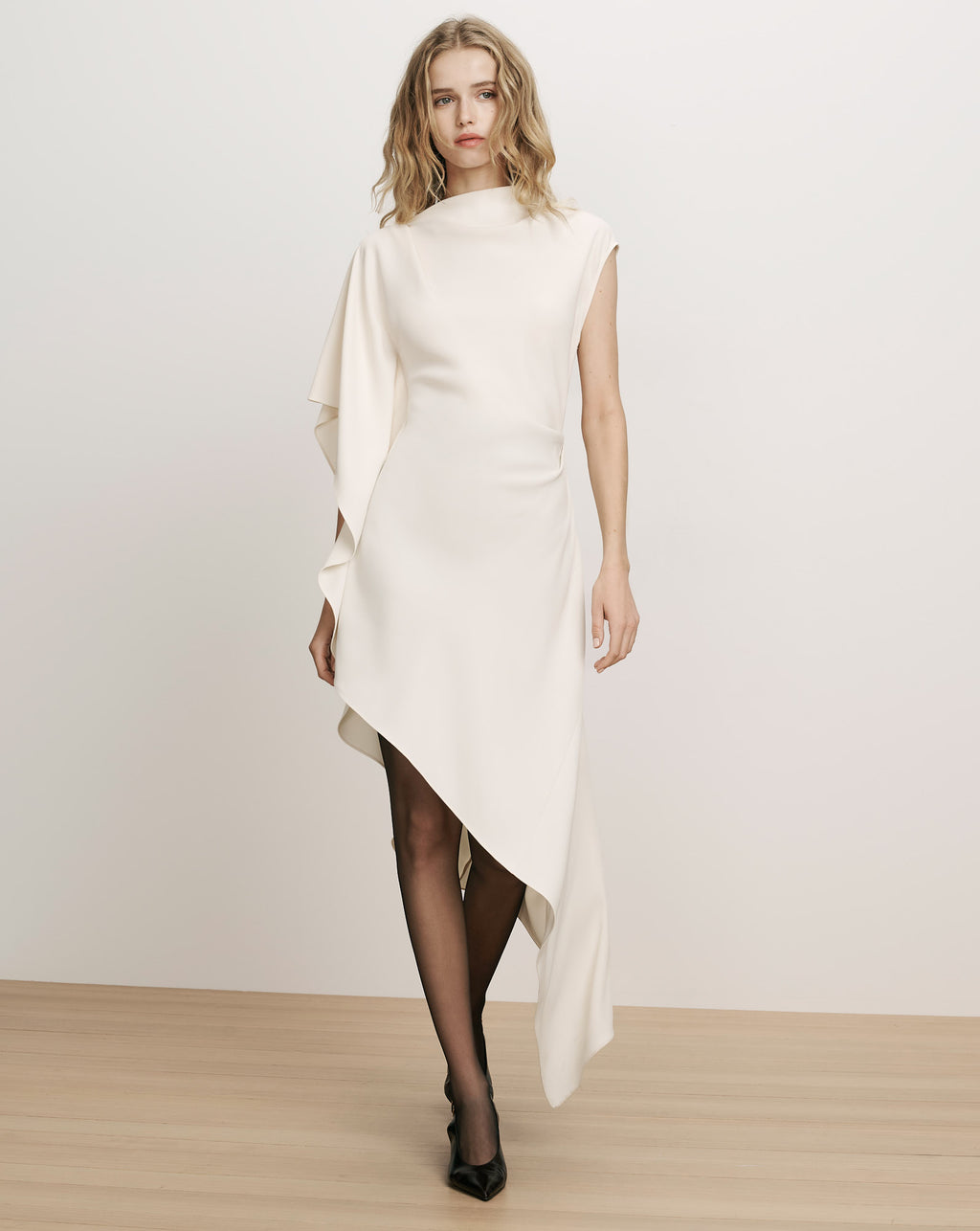 Veronica Beard White asymmetric dress with draped overlay.