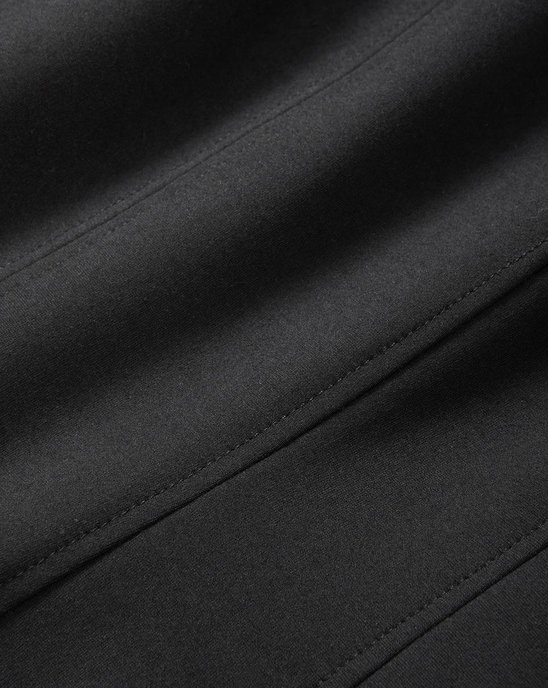 Veronica Beard Black fabric with smooth texture and stitched seams.