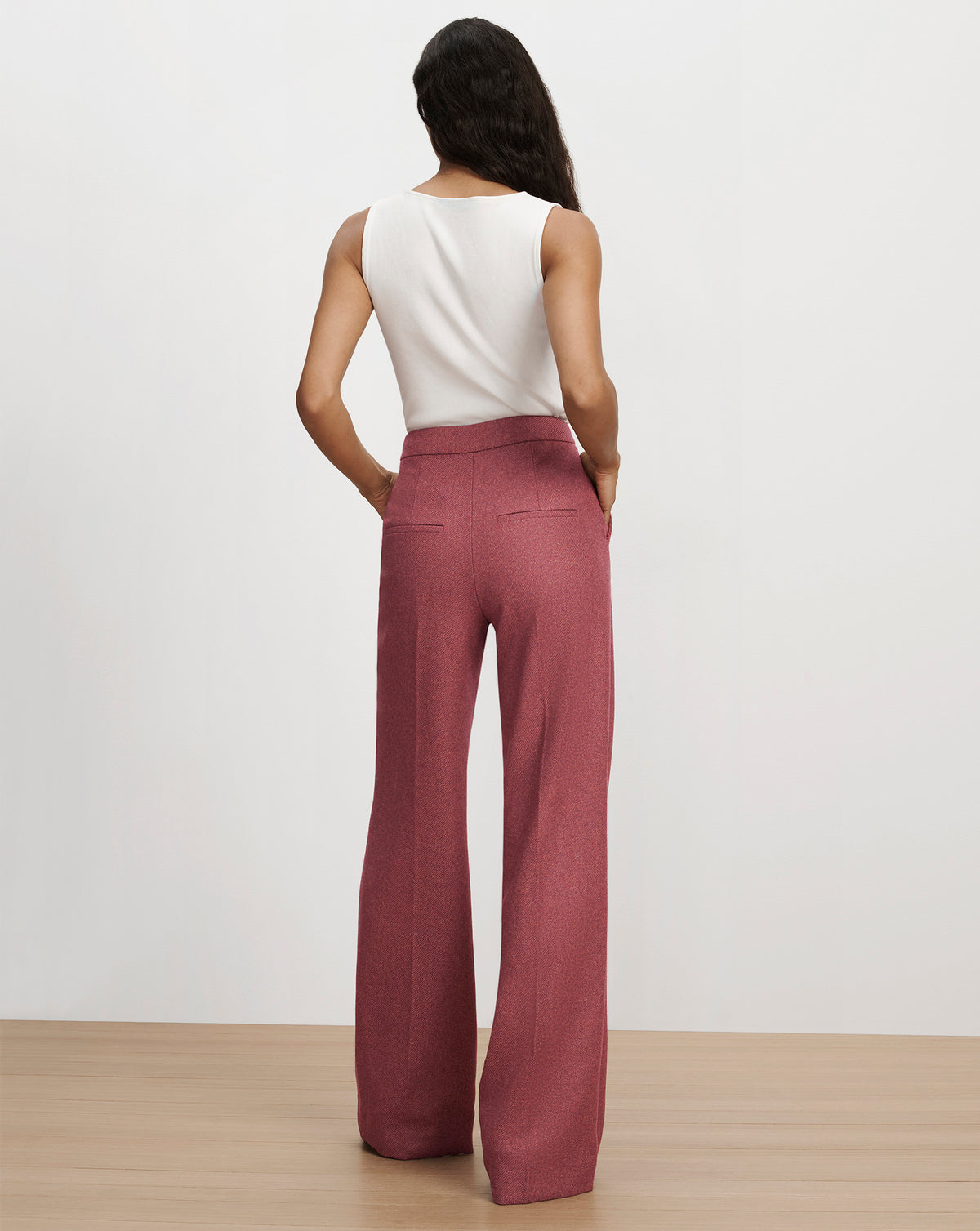 Veronica Beard Pink wide-leg trousers and white tank top.