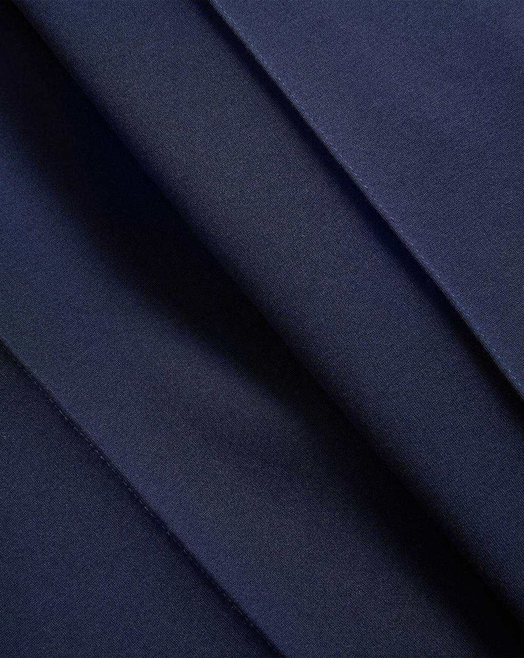 Veronica Beard Dark blue fabric with neat folded pleats.