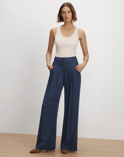 Veronica Beard Blue pleated wide-leg trousers and ribbed tank top.