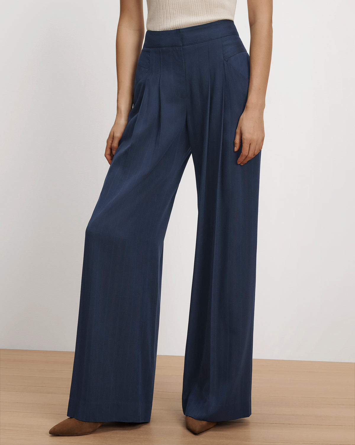 Veronica Beard Navy blue wide-leg pleated pinstripe trousers.
