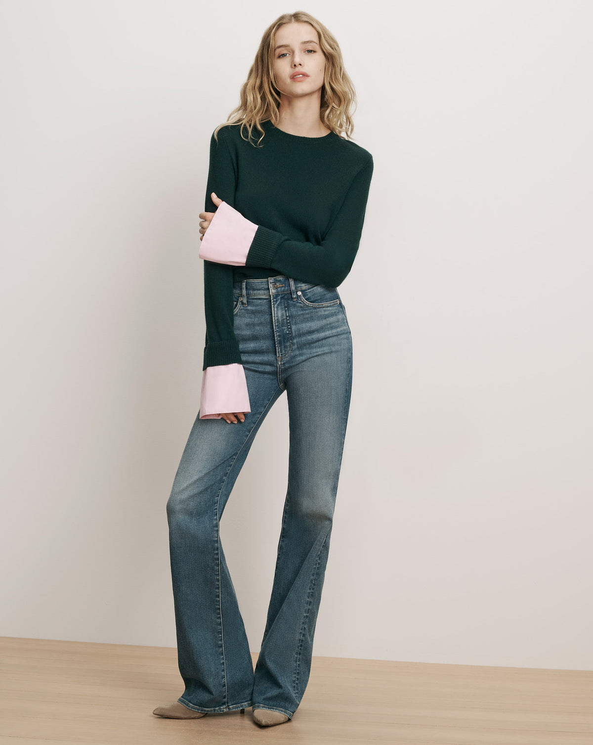 Veronica Beard Dark green sweater with pink flared cuffs.