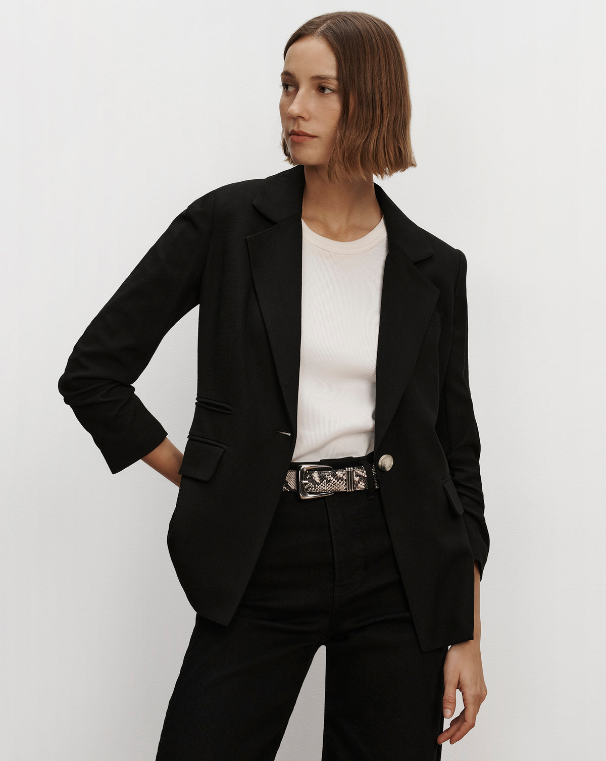 Veronica Beard Black blazer, white t-shirt, and pants.