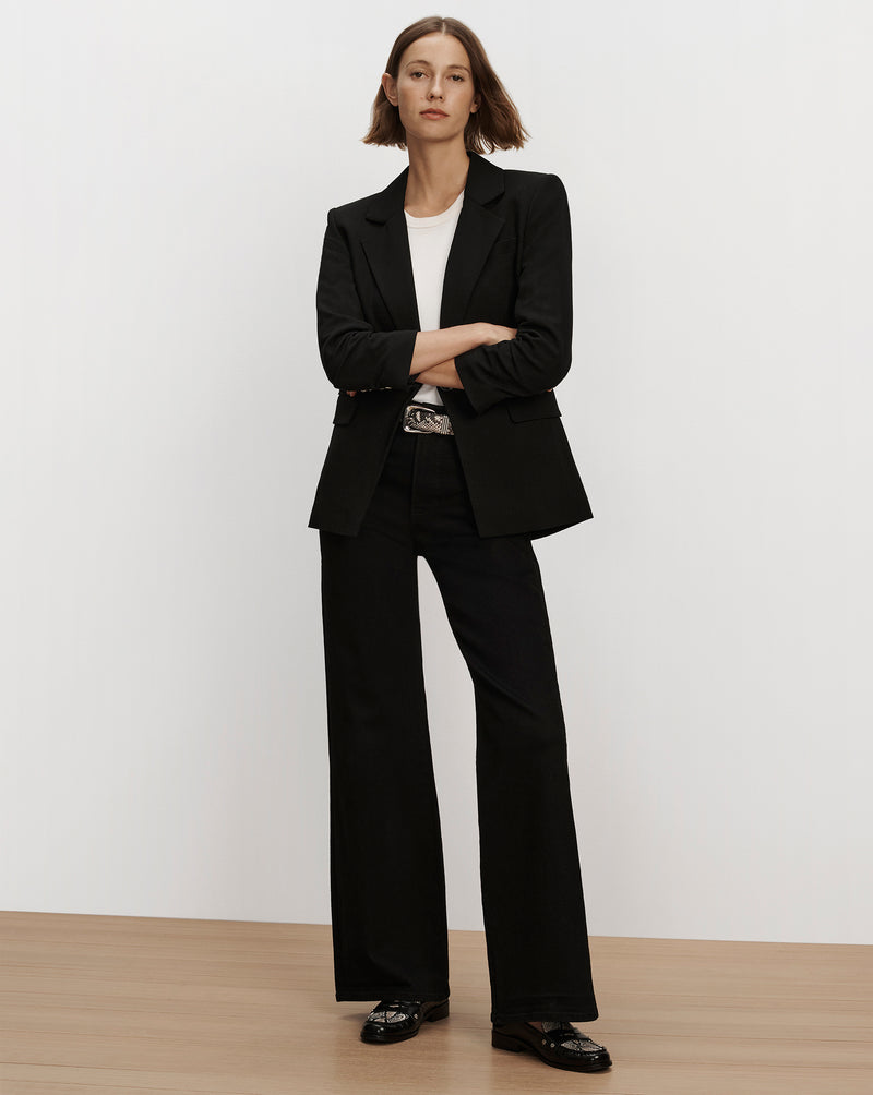 Veronica Beard Black blazer, white t-shirt, and pants.