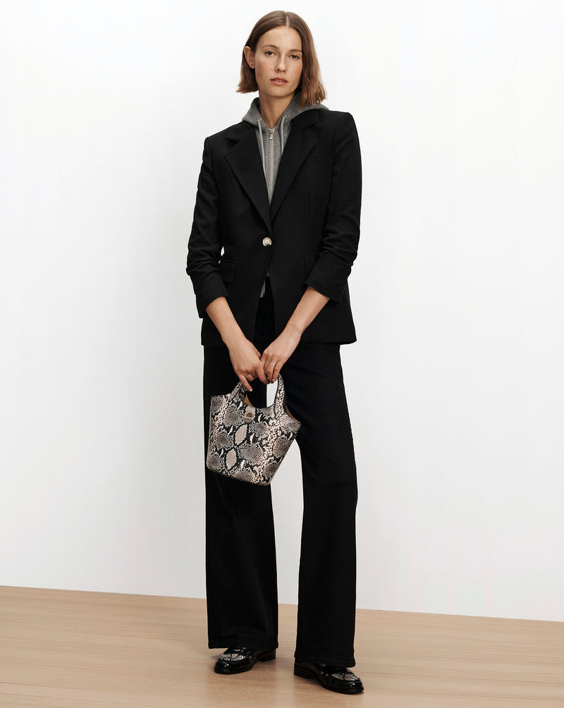 Veronica Beard Black tailored blazer and wide-leg trousers.