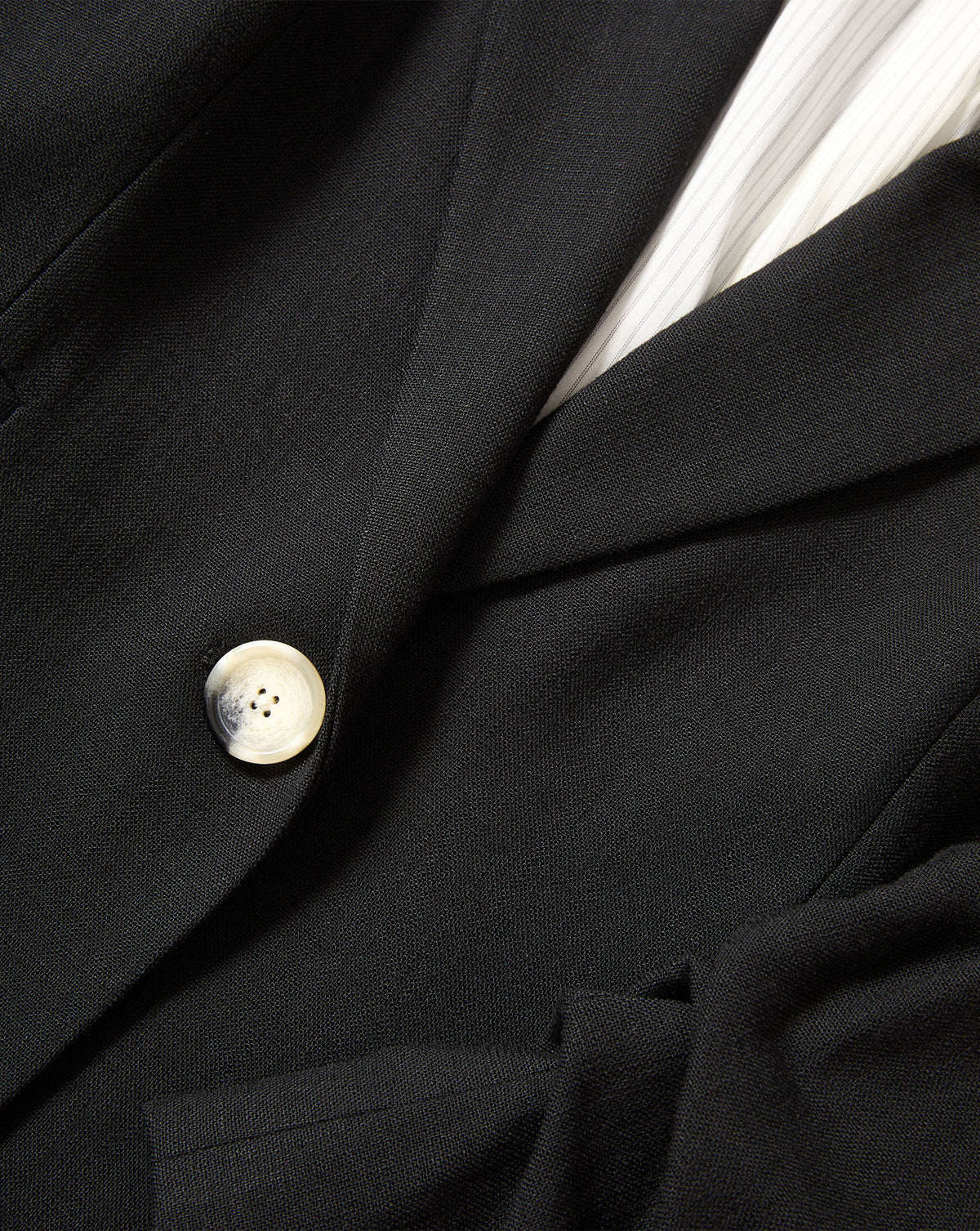 Veronica Beard Black blazer with single marble button.