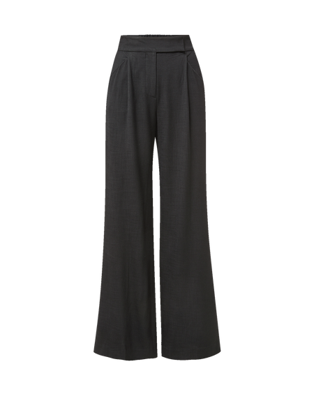 Veronica Beard Cream sweater and black wide-leg trousers.