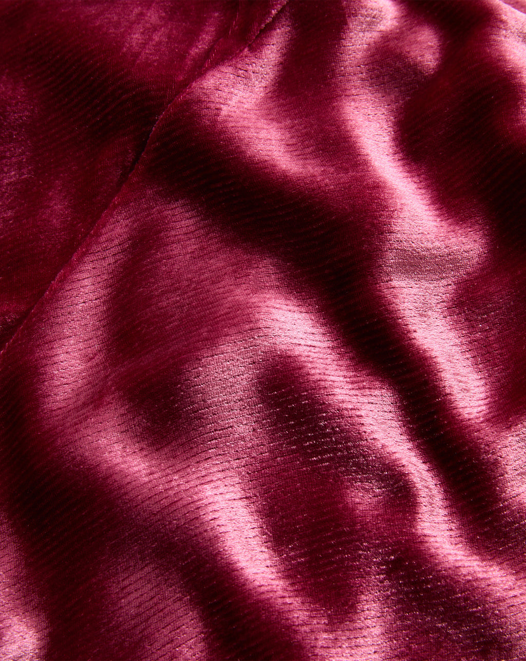 Veronica Beard Red velvet fabric with ribbed texture.