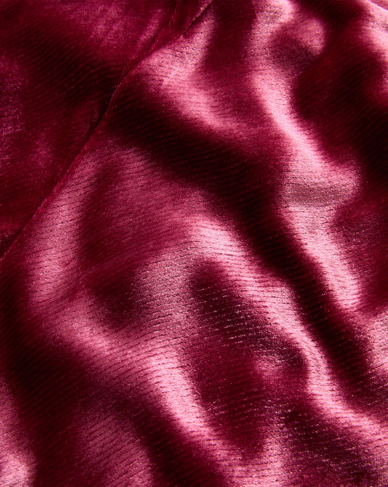 Veronica Beard Red velvet fabric with ribbed texture.
