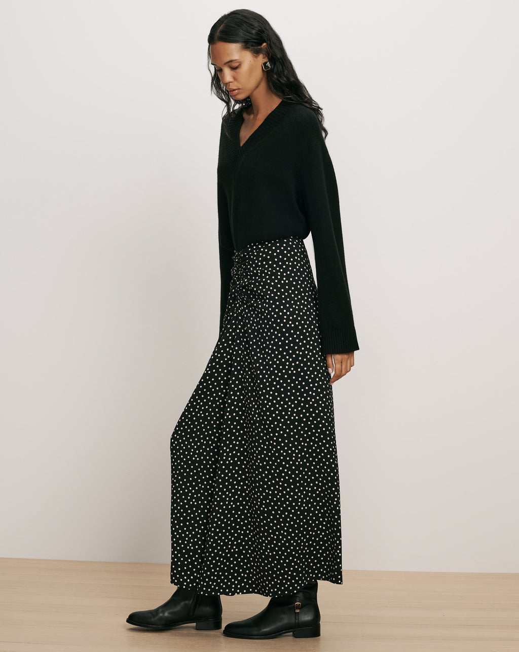Veronica Beard Black polka dot maxi skirt and black sweater.