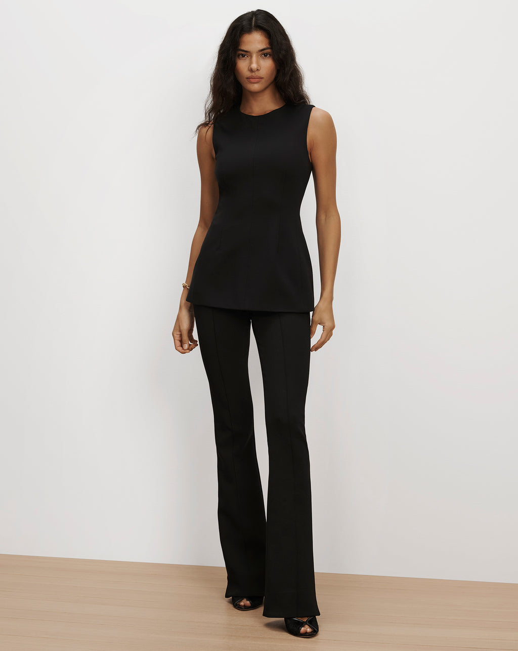 Veronica Beard Black fitted sleeveless top and flare trousers.