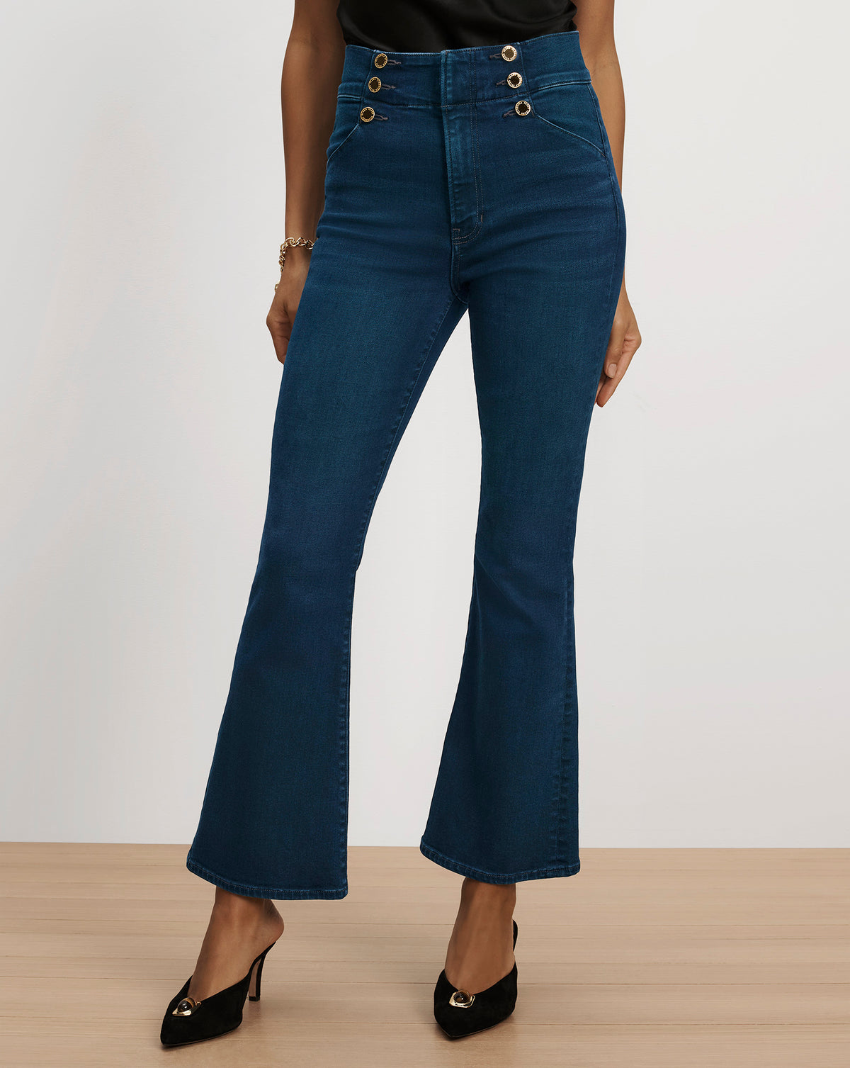 Veronica Beard Dark blue high-waist flared denim trousers.