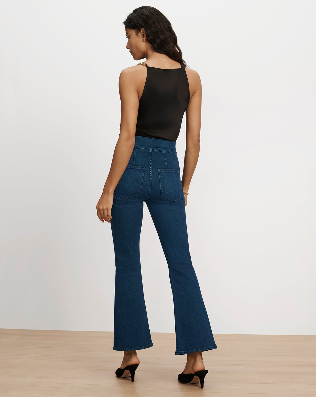 Veronica Beard Blue high-waisted flare jeans with back pockets.