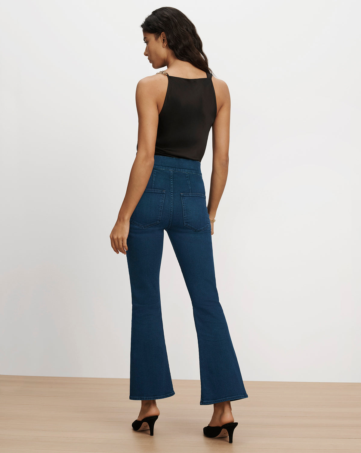 Veronica Beard Blue high-waisted flare jeans with back pockets.