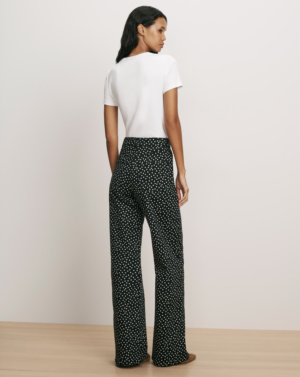 Veronica Beard Black and white polka dot wide-leg trousers.