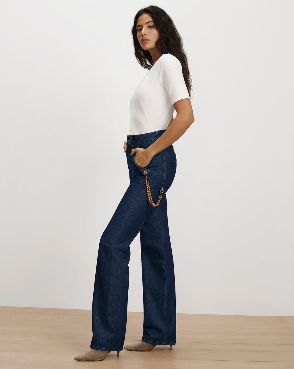 Veronica Beard Dark blue wide-leg denim jeans with chain detail.