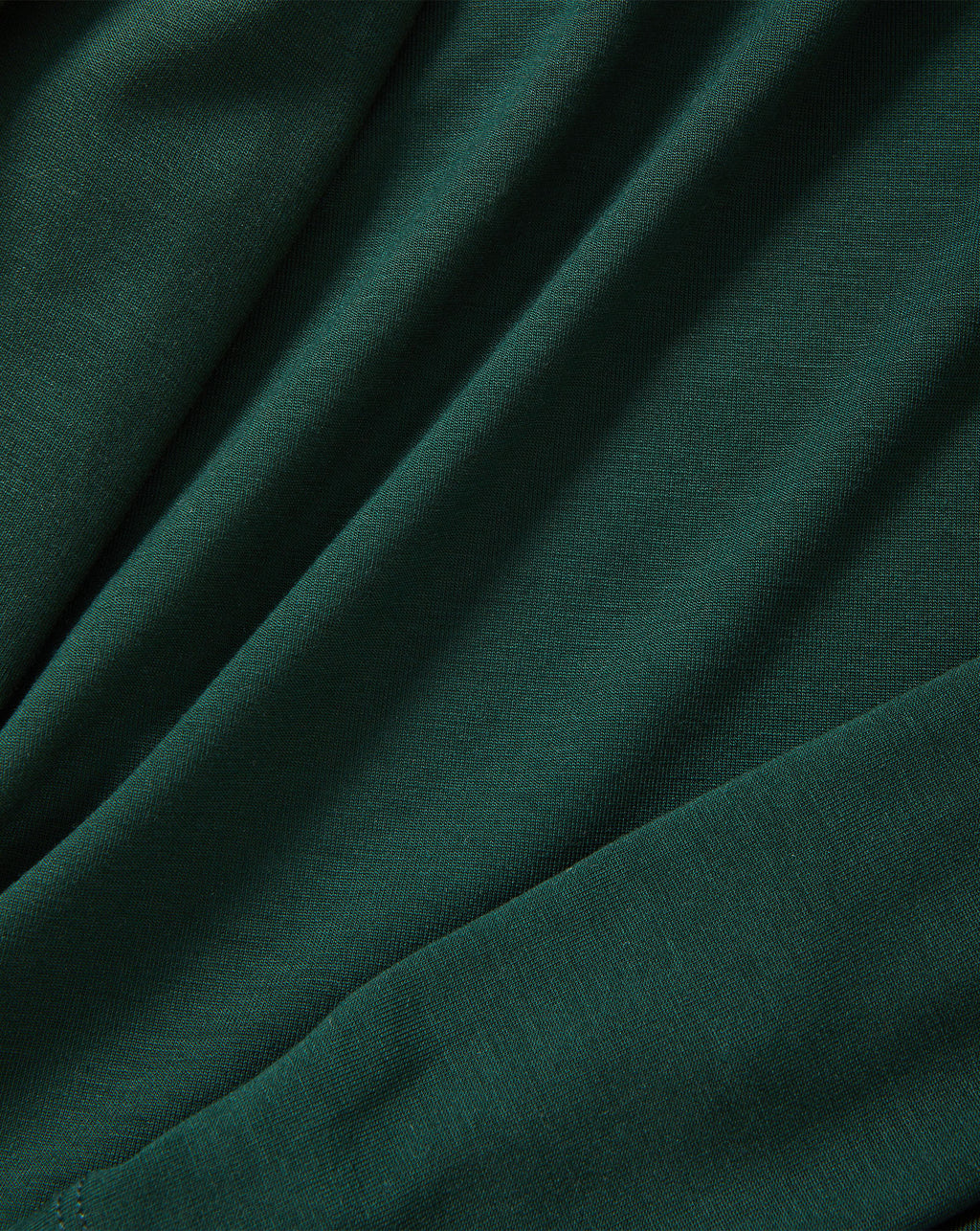 Veronica Beard Dark green textured knit fabric with soft folds.
