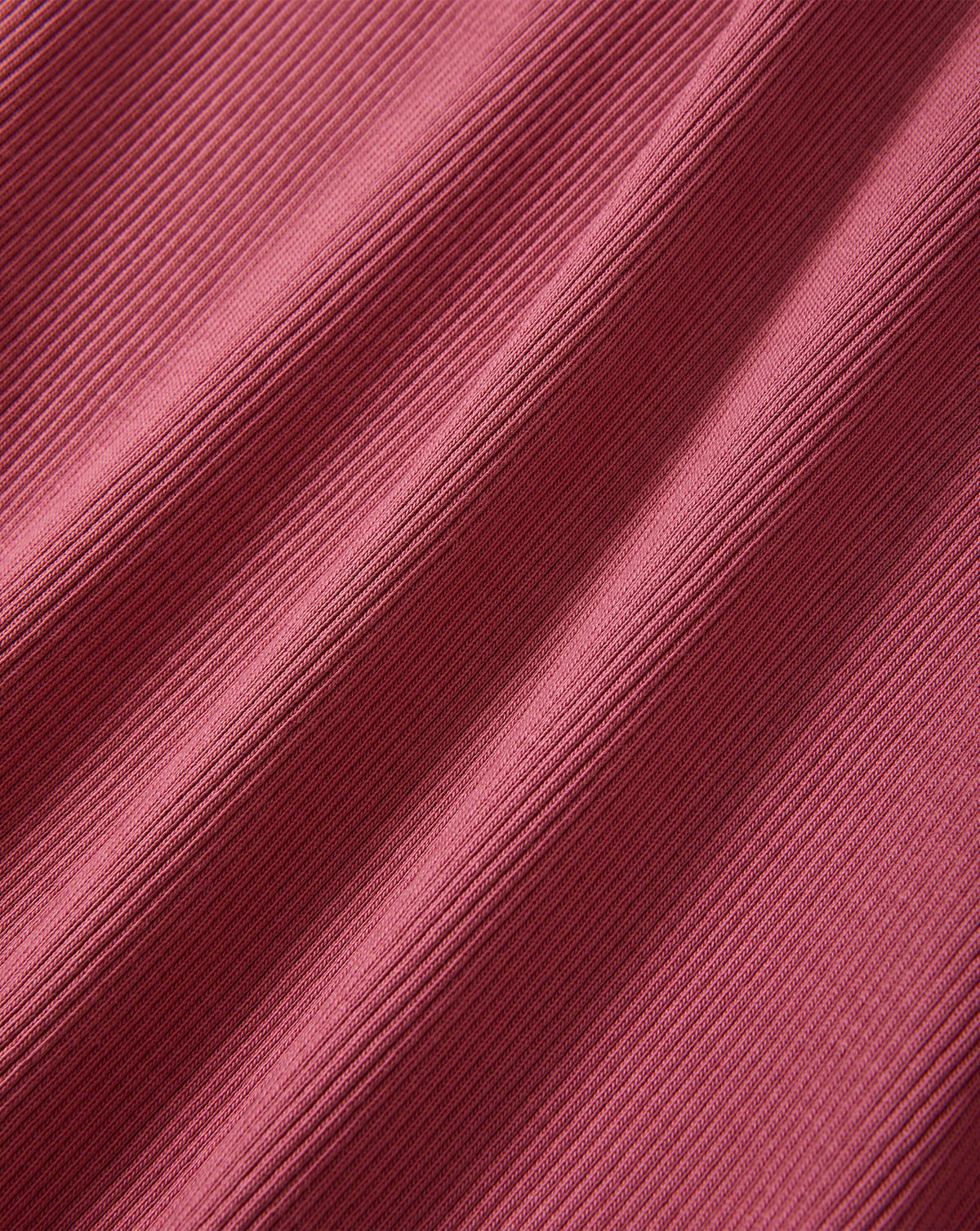 Veronica Beard Pink ribbed knit fabric with diagonal folds.
