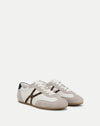 Veronica Beard White and grey leather sneakers with leopard print detail.