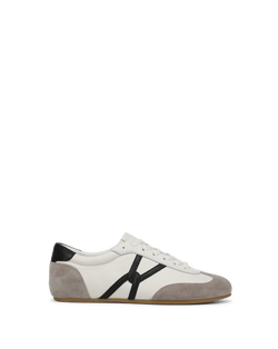 Veronica Beard White, grey, and black leather sneaker with side strap.