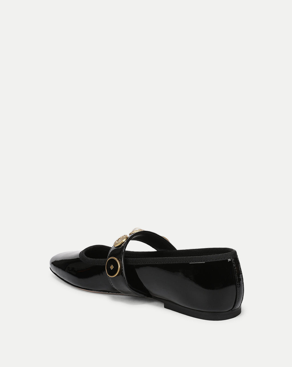 Veronica Beard Black patent leather flat shoe with gold medallion strap.
