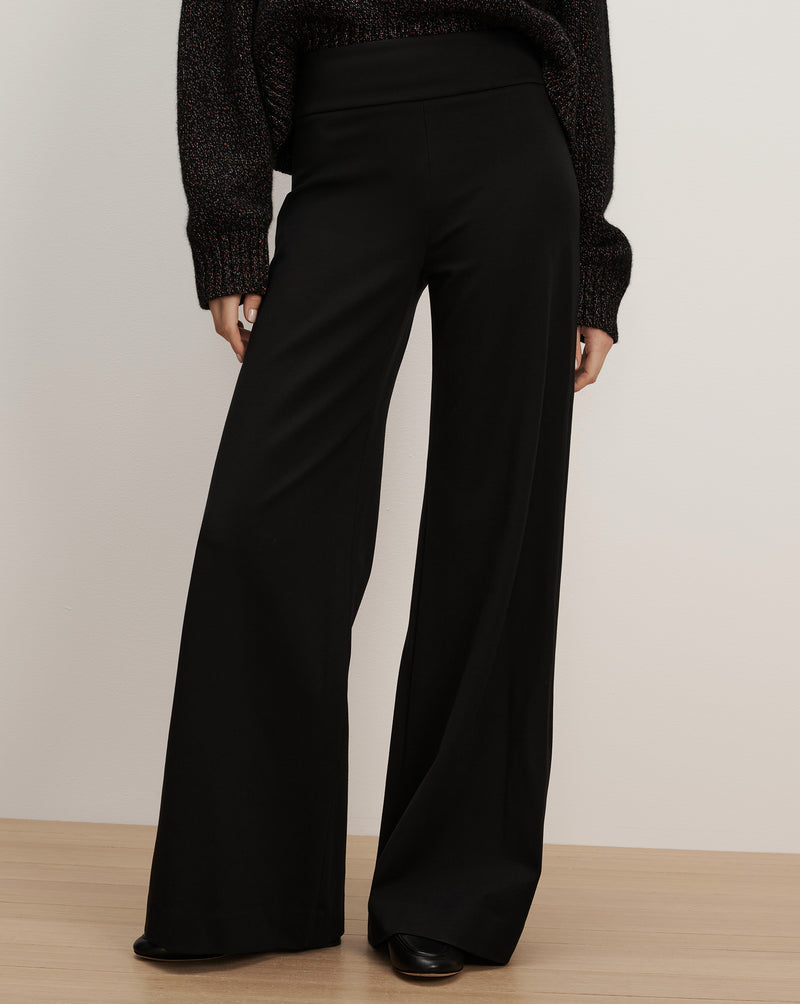 Veronica Beard Black high-waisted wide-leg knit trousers.
