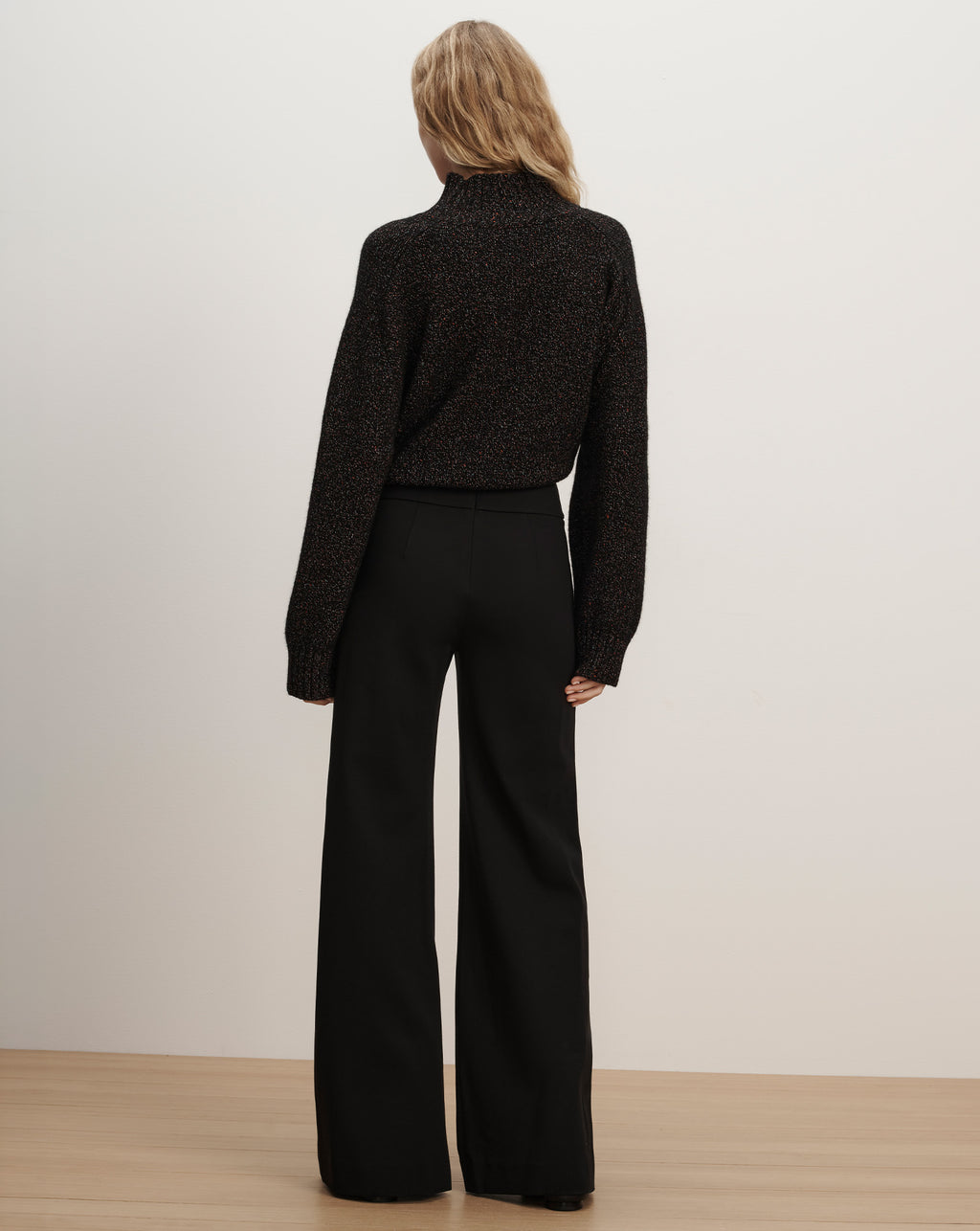 Veronica Beard Black wide-leg trousers and sparkly sweater.