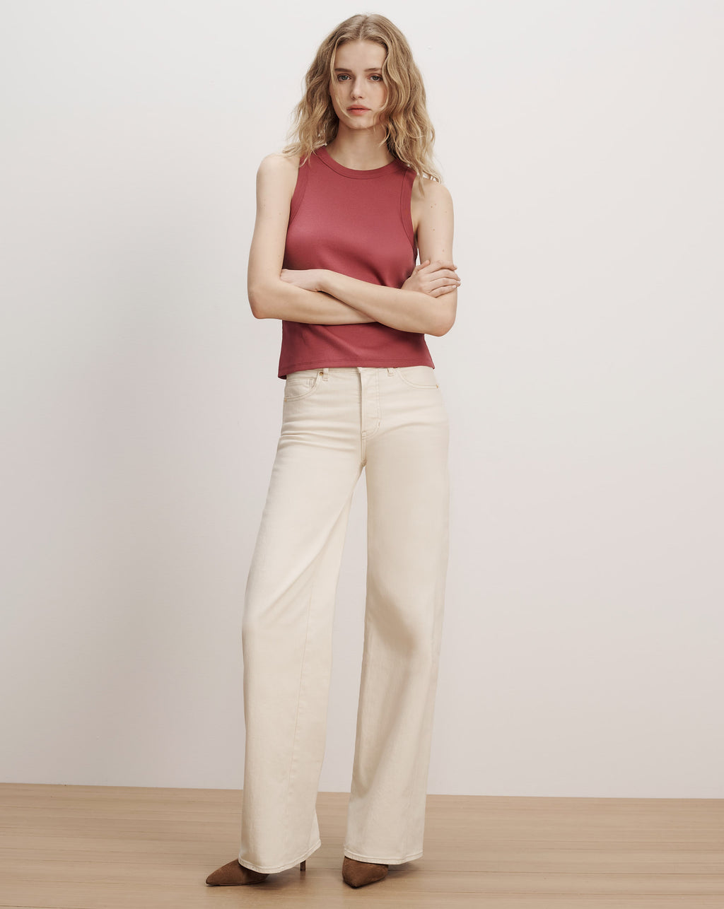 Veronica Beard Red ribbed tank top, cream wide-leg pants.