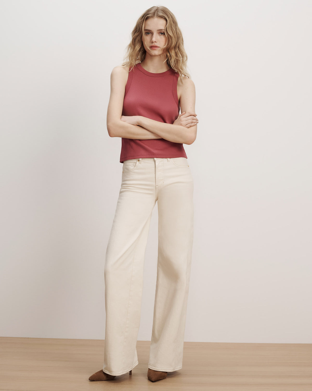 Veronica Beard Red ribbed tank top, cream wide-leg pants.