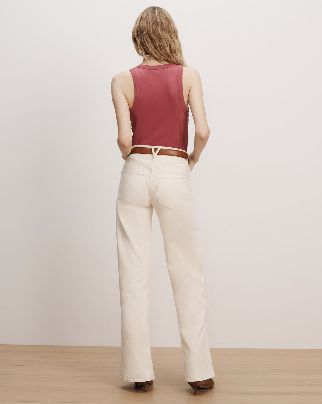 Veronica Beard Red ribbed tank top and cream jeans.