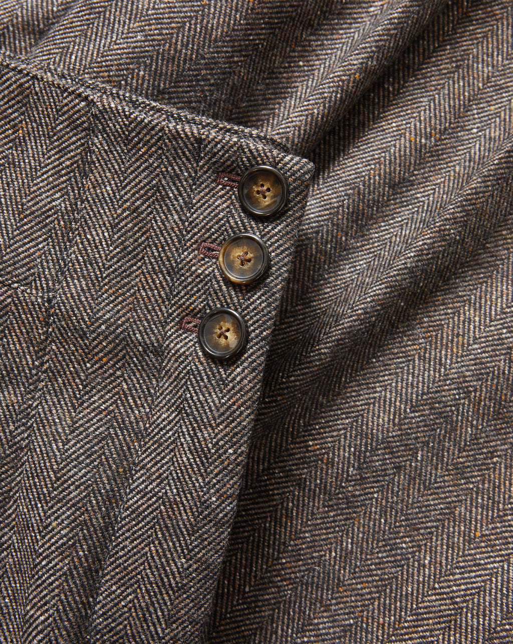 Veronica Beard Brown herringbone tweed jacket with three buttons.