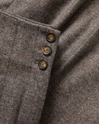 Veronica Beard Brown herringbone tweed jacket with three buttons.