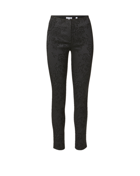 Veronica Beard Black sleeveless turtleneck sweater and floral trousers.