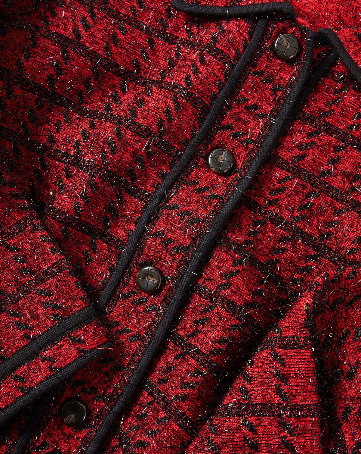 Veronica Beard Red houndstooth tweed cardigan with black buttons.