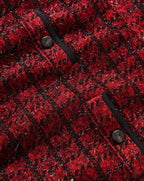 Veronica Beard Red textured tweed jacket with black trim.