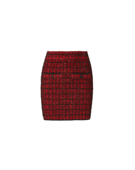 Veronica Beard Black turtleneck sweater and red tweed miniskirt.