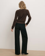 Veronica Beard Brown fuzzy sweater and black wide-leg jeans.