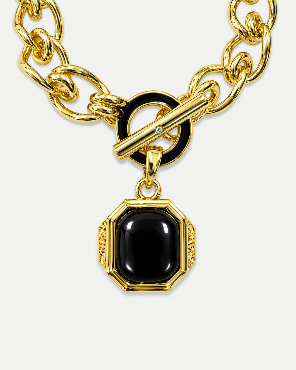 Veronica Beard Gold toggle chain necklace with black stone pendant.