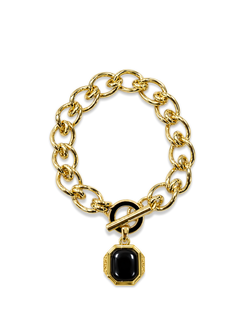 Veronica Beard Gold chain bracelet with black gemstone pendant.
