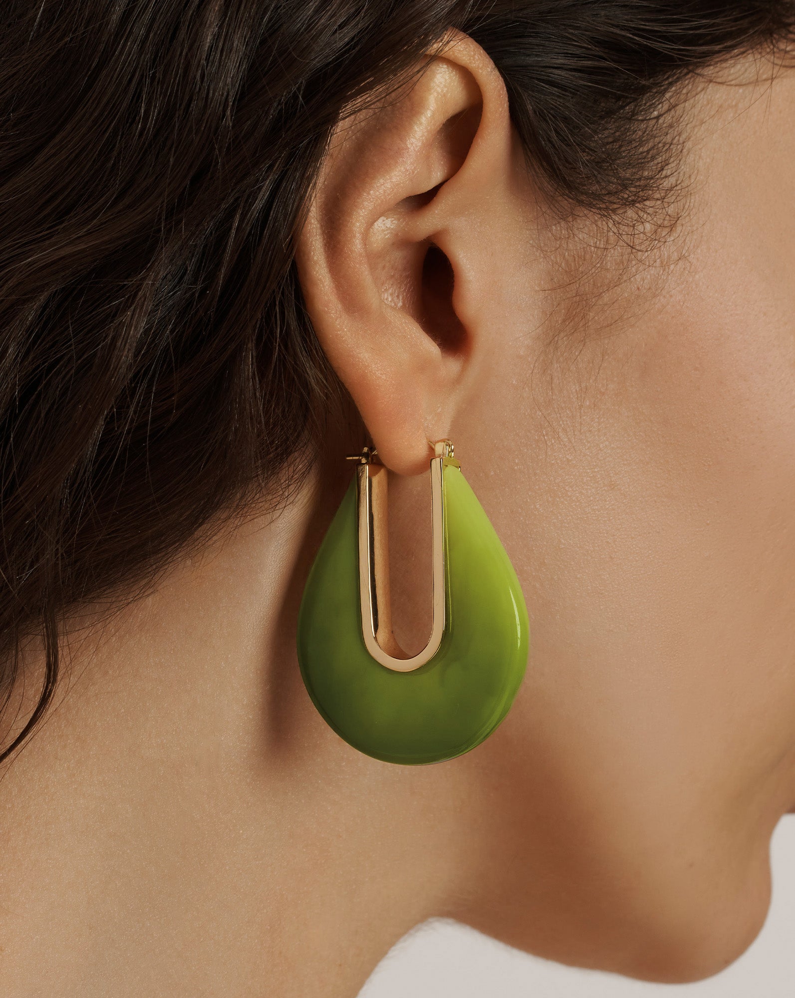Veronica Beard Green resin teardrop hoop earrings with a gold-toned U-shaped insert.