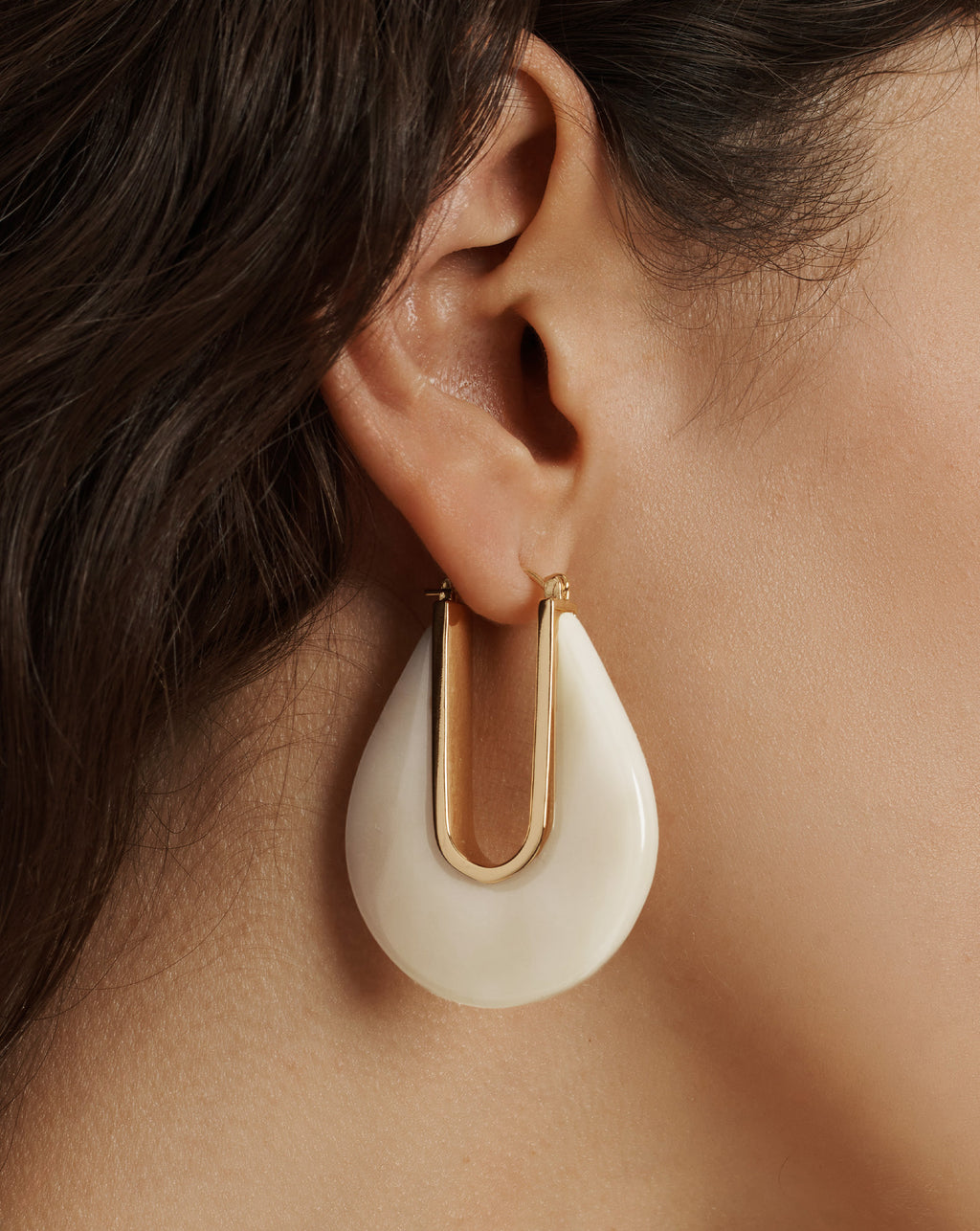 Veronica Beard White teardrop earrings with a gold-tone U-shaped insert.