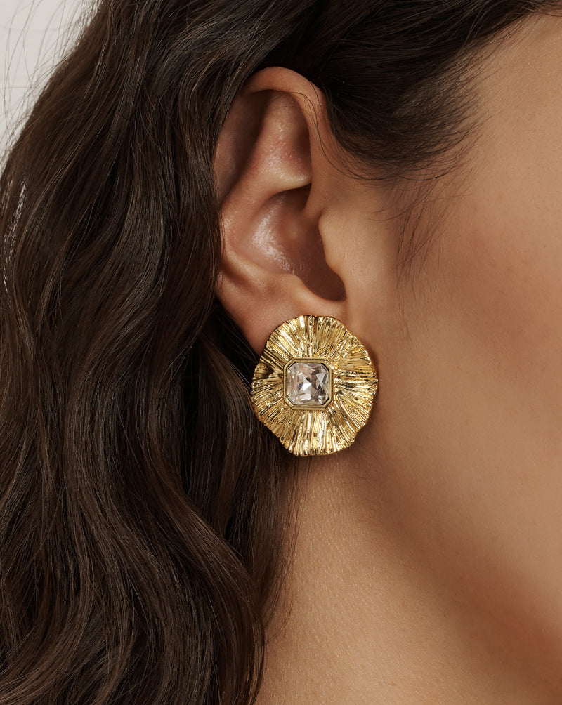 Veronica Beard Gold-toned textured stud earring with a square clear crystal in the center.