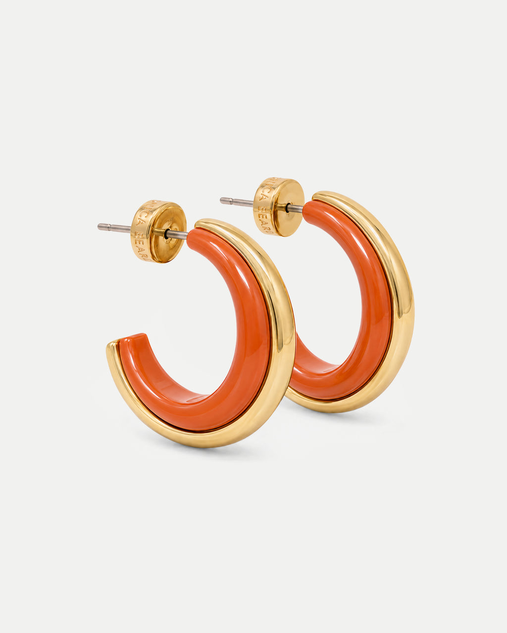Veronica Beard Orange and gold thick hoop earrings.