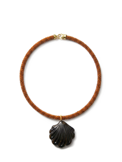 Veronica Beard Brown beaded necklace with a dark shell pendant.