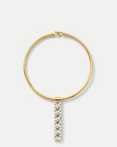 Veronica Beard Gold collar necklace with hanging crystal pendant.
