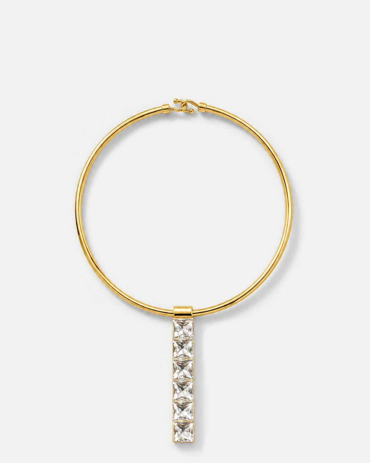 Veronica Beard Gold collar necklace with hanging crystal pendant.
