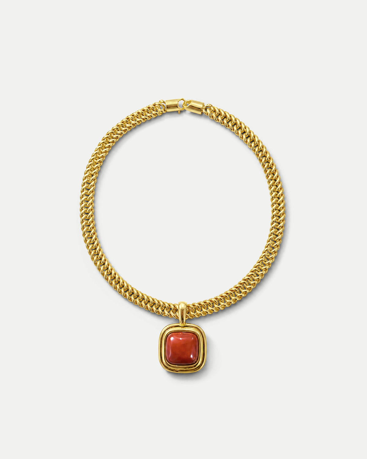 Veronica Beard Gold chain necklace with red stone pendant.