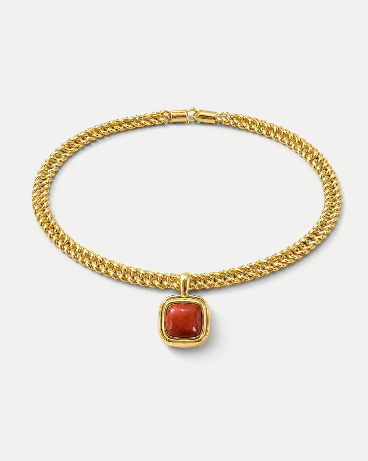 Veronica Beard Gold chain necklace with a square red gemstone pendant.