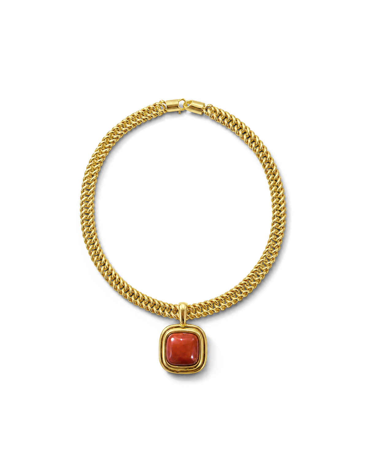 Veronica Beard Gold chain necklace with a red gemstone pendant.